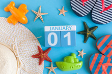 January 1st. Image Of January 1 Calendar With Summer Beach Accessories And Traveler Outfit On Background. Winter Like Summer Vacation Concept
