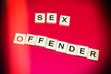 Wooden Blocks On A Red Background Spelling Words Sex Offender. Vintage Style
