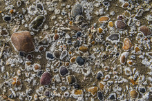 Overhead View Of Pebbles On Sand