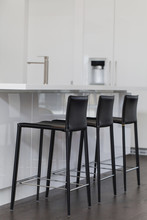 Chairs Arranged In Kitchen At Home