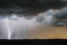 Scenic View Of Thunderstorm Lightning Over Landscape
