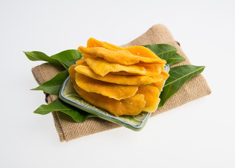 Wall Mural - Dried Mango or Dried Mango slices on a background.