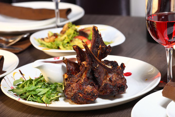 luxury dinner served on the table with glass of red wine