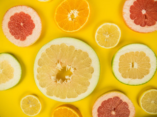 Colorful set of cut slices of citrus fruits of orange, lime, grapefruit, tangerine, lemon and pomelo. Mixed fresh health fruit. Background with citrus-fruit of lemon, orange and grapefruit slices.