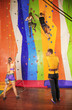 © Africa Studio - Young people in climbing gym