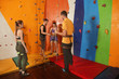 © Africa Studio - Young people in climbing gym