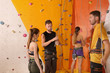 © Africa Studio - Young people in climbing gym