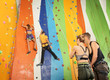 © Africa Studio - Young people in climbing gym