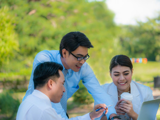 Business people having a business conversation in the park