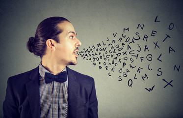 Man talking with alphabet letters coming out of his mouth. Communication, information, intelligence concept