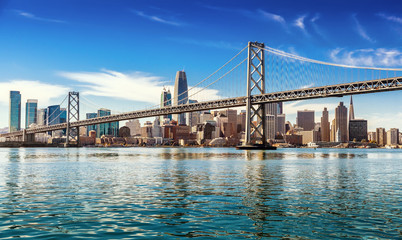 downtown san francisco and oakland bay bridge on sunny day