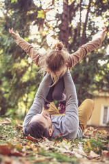 Little girl playing with Dad.