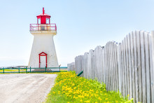 Bonaventure Village Pointe Lighthouse In Quebec, Canada Gaspesie Region With Red And White Painted Colors, Fence