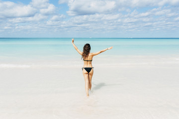 Wall Mural - Young woman relax on the beach.