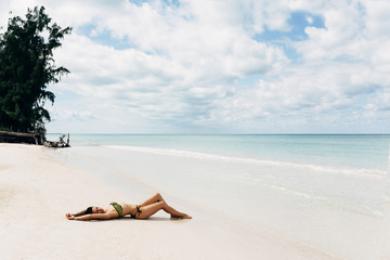 Wall Mural - Young woman relax on the beach.