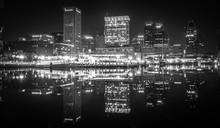 Baltimore  Skyline And Docks Reflecting In The Water At Night