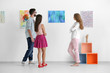 © Africa Studio - Group of people in art gallery