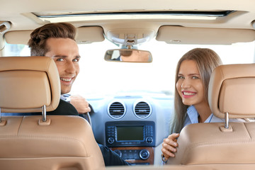 Sticker - Beautiful young couple in car