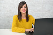 © Philipimage - confident young beautiful businesswoman with laptop at office