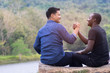 © arrowsmith2 - Concept of best friends,African man and asian man  shaking hands with happy and smile.