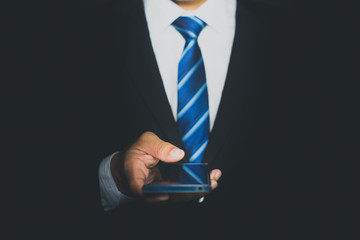 Wall Mural - a young man using a smart phone