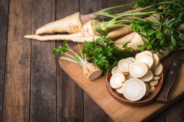 Sticker - Fresh parsley root on the wooden table