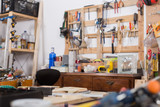 Fototapeta Paryż - Tools in the board and in garage. Workshop scene