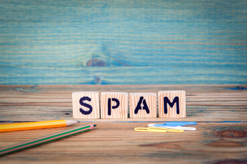 Wall Mural - spam - name from wooden letters. office desk, informative and communication background.