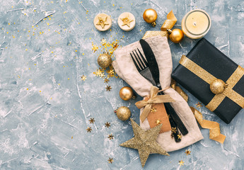 Canvas Print - Holiday place setting with napkin, fork and knife tied with a gold ribbon