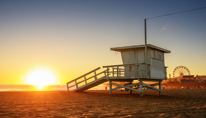 Santa Monica beach lifeguard tower in California USA at sunset