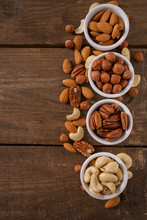 Mixed Nuts On Wooden Surface