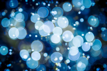 winter holiday background in an abstract defocus ice blue bokeh