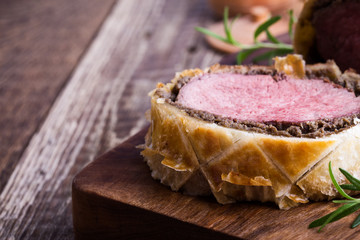 Wall Mural - Beef Wellington, classic steak dish on cutting board