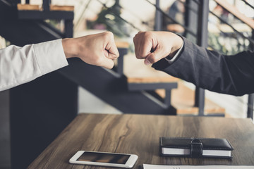 Aufkleber - Teamwork of businessman partnership giving fist bump to greeting start up business strategy project