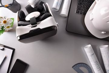 Virtual reality glasses on architect office table top view