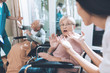 © VadimGuzhva - Medical workers argue with an elderly couple in a nursing home.