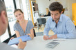 © auremar - Couple in office receiving file from agent