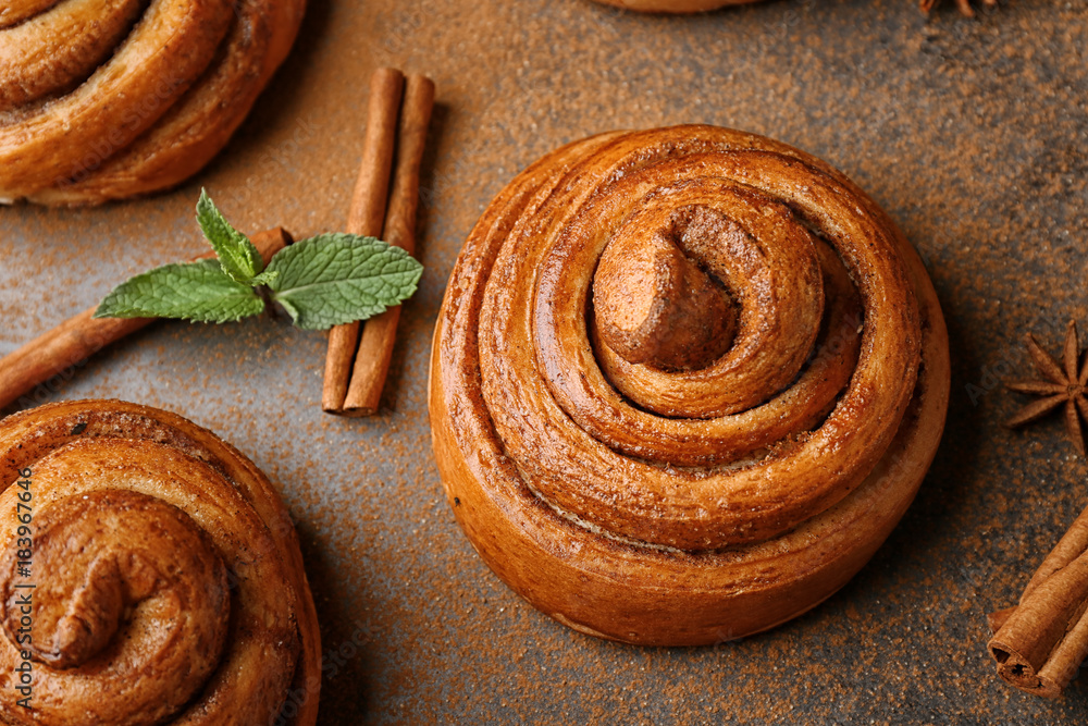 Sweet cinnamon rolls on table