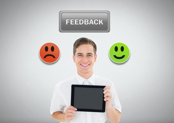 Canvas Print - Man holding tabelet with smiley feedback icons