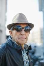 Headshot Of A Senior Fashionable Man With Hat And Sunglasses