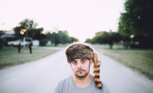 Man With A Racoon Cap