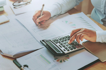 Fototapete - close up hand businesswoman using calculator for calculate finance accounting