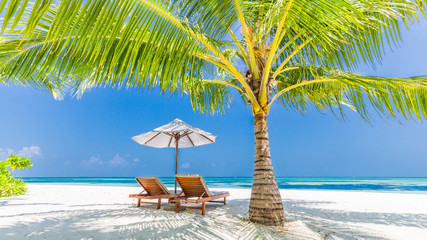 Beautiful beach. Chairs on the sandy beach near the sea. Summer holiday and vacation concept. Inspirational tropical scene. Tranquil scenery, relaxing tropical landscape design