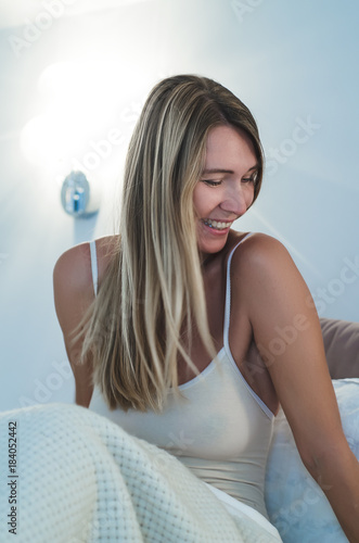 Beautiful Woman With Long Blonde Hair In Bed After Wake Up