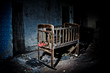 Old creepy eerie wooden baby crib in abandoned house. Horror concept