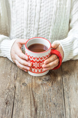 Canvas Print - hot winter drink in hands