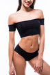 © F8  \ Suport Ukraine - Woman in black swimsuit with perfect abs, fit body on white background