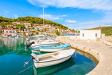 Fototapeta  - Fishing boats mooring in picturesque Pucisca port, Brac island, Croatia