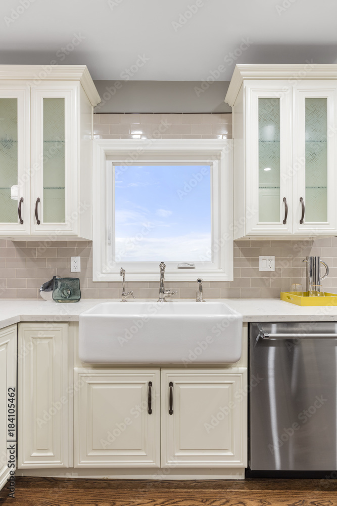 Modern kitchen interio with new stainless steel appliance and Farmhouse Sink.