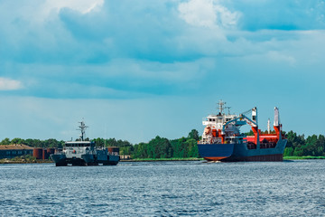 Blue cargo ship underway